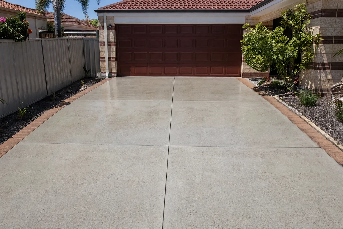 Driveway after pressure cleaning, bright clean concrete