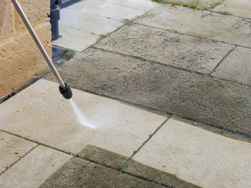 Limestone paving being pressure cleaned